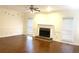 Living room with hardwood floors, fireplace and large windows at 221 Larkshyre Trl, Lawrenceville, GA 30043