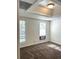 Well-lit basement bedroom with carpet and two windows at 221 Larkshyre Trl, Lawrenceville, GA 30043