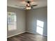 Bright bedroom featuring ceiling fan and vinyl flooring at 3486 Pine Log Ne Rd, Rydal, GA 30171