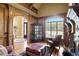 Cozy library with wood paneling, fireplace and large window at 2145 Jones Phillips Rd, Dacula, GA 30019