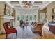 Spacious living room featuring a fireplace and bay windows at 2145 Jones Phillips Rd, Dacula, GA 30019