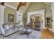 Bright living room with hardwood floors, comfortable seating, and views to kitchen at 2145 Jones Phillips Rd, Dacula, GA 30019