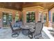 Brick covered patio with fire pit table and comfortable seating area at 2145 Jones Phillips Rd, Dacula, GA 30019