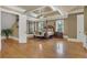 Luxurious main bedroom with hardwood floors, a large four poster bed, and tray ceiling at 2145 Jones Phillips Rd, Dacula, GA 30019