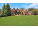 Brick house with large lawn and driveway at 2145 Jones Phillips Rd, Dacula, GA 30019
