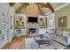 Living room boasts a stone fireplace, built-in shelving, and hardwood floors at 2145 Jones Phillips Rd, Dacula, GA 30019