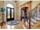 Grand entry with curved staircase and hardwood floors at 2145 Jones Phillips Rd, Dacula, GA 30019