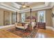 Spacious main bedroom with hardwood floors, a four poster bed, and ornate rug at 2145 Jones Phillips Rd, Dacula, GA 30019