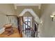 Grand staircase with wrought iron railing and ornate details at 2145 Jones Phillips Rd, Dacula, GA 30019