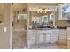 Elegant bathroom with double vanity, glass shower, and frameless mirror at 2145 Jones Phillips Rd, Dacula, GA 30019