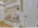 Convenient laundry room with built-in bench, storage, and modern washer/dryer at 2145 Jones Phillips Rd, Dacula, GA 30019