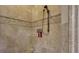 Elegant shower with beige tile and built-in shampoo niche at 2145 Jones Phillips Rd, Dacula, GA 30019