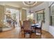 Bright breakfast nook with a round table and views to the backyard at 2145 Jones Phillips Rd, Dacula, GA 30019