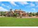 Pergola and lounge chairs situated near the pool, overlooking a large lawn at 2145 Jones Phillips Rd, Dacula, GA 30019