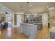 Gourmet kitchen with large island, custom cabinetry, and granite countertops at 2145 Jones Phillips Rd, Dacula, GA 30019