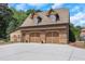 Three-car brick garage with extra storage space at 2145 Jones Phillips Rd, Dacula, GA 30019