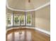 Sunlit sitting room with large windows and hardwood floors at 2145 Jones Phillips Rd, Dacula, GA 30019