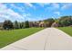 Brick home with long driveway and lush lawn at 2145 Jones Phillips Rd, Dacula, GA 30019