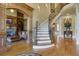 Elegant entryway featuring a curved staircase and hardwood floors at 2145 Jones Phillips Rd, Dacula, GA 30019