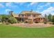 Brick home with firepit and seating area overlooking the lawn at 2145 Jones Phillips Rd, Dacula, GA 30019