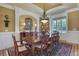 Formal dining room with large table and hardwood floors at 2145 Jones Phillips Rd, Dacula, GA 30019