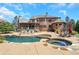 Luxury home with inviting pool, spa, and expansive patio perfect for entertaining at 2145 Jones Phillips Rd, Dacula, GA 30019
