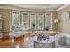 Bright sitting room with bay windows and hardwood floors at 2145 Jones Phillips Rd, Dacula, GA 30019