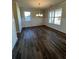 Spacious dining room with hardwood floors and wainscoting at 3627 Lockaby Way, Lawrenceville, GA 30044