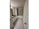 Clean bathroom with tile flooring, tub and vanity at 3627 Lockaby Way, Lawrenceville, GA 30044