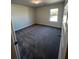 Bright bedroom with neutral carpeting and large window at 3627 Lockaby Way, Lawrenceville, GA 30044