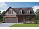 Brick home with two-car garage and landscaping at 3627 Lockaby Way, Lawrenceville, GA 30044