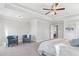 Main bedroom with tray ceiling and sitting area at 3646 Lockaby Way, Lawrenceville, GA 30044