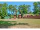 Large backyard with playset and shed at 3060 Orchard Sw Rd, Conyers, GA 30094