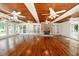 Spacious sunroom with hardwood floors and stone fireplace at 3060 Orchard Sw Rd, Conyers, GA 30094