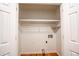 Laundry closet with built-in shelving at 3060 Orchard Sw Rd, Conyers, GA 30094