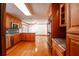 Modern kitchen with granite countertops and wood cabinets at 3060 Orchard Sw Rd, Conyers, GA 30094
