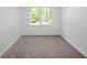Spacious bedroom with carpet and large windows at 3060 Orchard Sw Rd, Conyers, GA 30094
