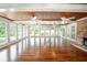 Sunroom with wood ceiling and hardwood floors, overlooking backyard at 3060 Orchard Sw Rd, Conyers, GA 30094
