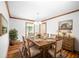 Formal dining room with wood floors, table, and sideboard at 3060 Orchard Sw Rd, Conyers, GA 30094