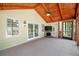 Relaxing screened porch with fireplace, ceiling fan, and access to backyard at 3060 Orchard Sw Rd, Conyers, GA 30094