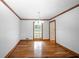 Bright dining room with wood floors and large window at 3060 Orchard Sw Rd, Conyers, GA 30094