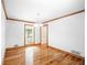 Bright dining room with wood floors and large window at 3060 Orchard Sw Rd, Conyers, GA 30094