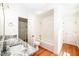 Main bathroom with granite countertop, bathtub, and shower at 3060 Orchard Sw Rd, Conyers, GA 30094