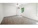 Bright bedroom with carpet, built-in shelving, and window at 3060 Orchard Sw Rd, Conyers, GA 30094