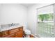 Bathroom features granite vanity and large window at 3060 Orchard Sw Rd, Conyers, GA 30094