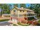 Two story home with large windows and a two car garage at 3060 Orchard Sw Rd, Conyers, GA 30094