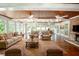 Sunroom with wood ceiling, hardwood floors and large windows at 3060 Orchard Sw Rd, Conyers, GA 30094