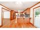 Open concept kitchen with hardwood floors and island at 3060 Orchard Sw Rd, Conyers, GA 30094