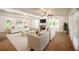 Spacious living room with fireplace and access to sunroom at 3060 Orchard Sw Rd, Conyers, GA 30094