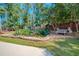 Stone pond with lush landscaping and seating at 3060 Orchard Sw Rd, Conyers, GA 30094